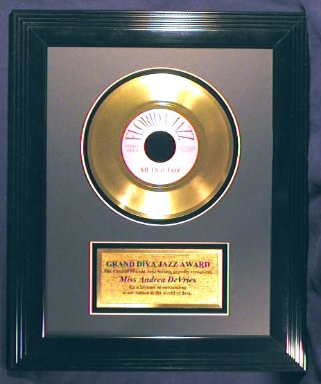 7 inch gold record with large black frame